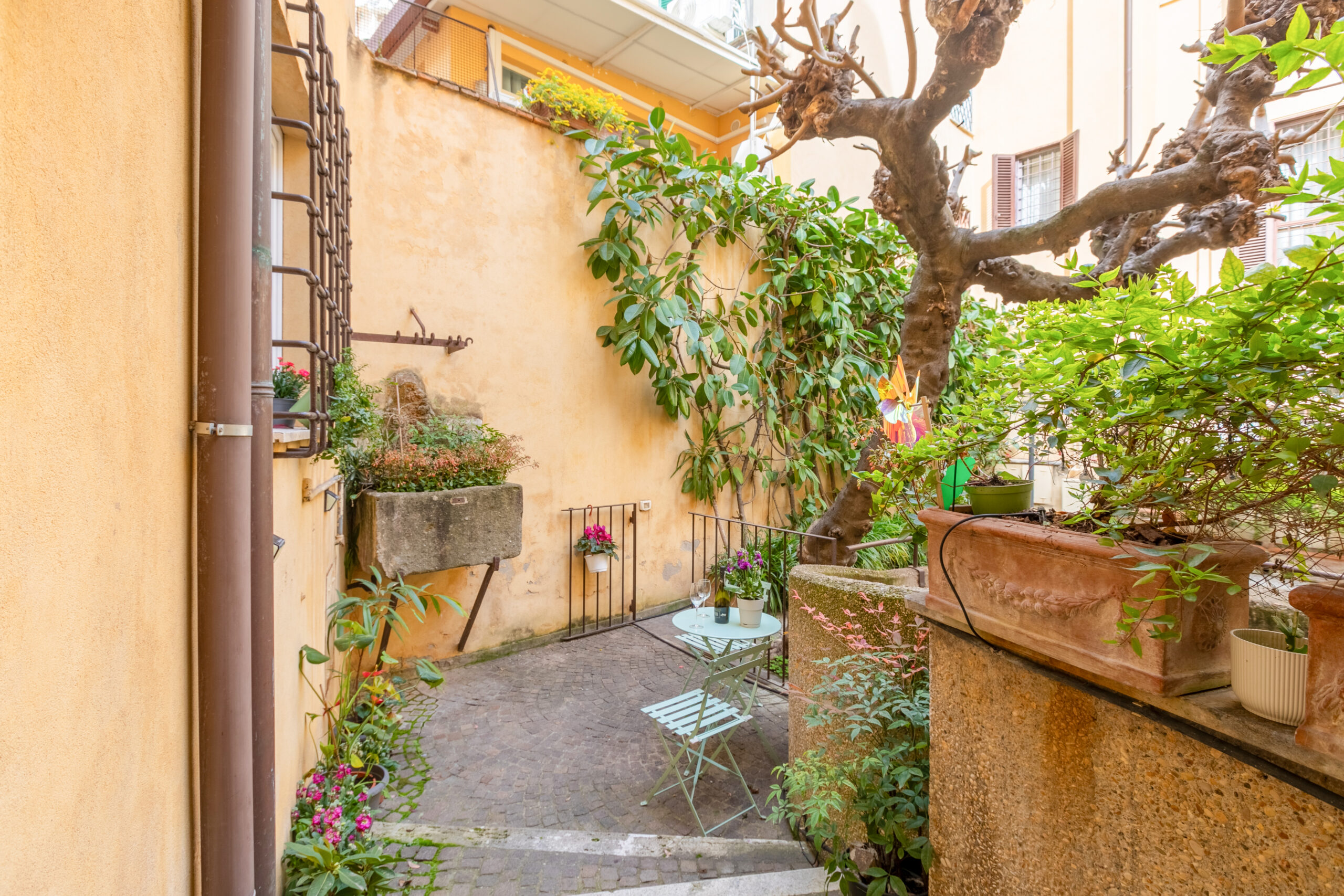 Private courtyard patio at Quiet Trevi Fountain Apartment in Rome historic center