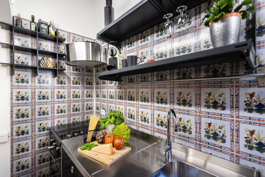 Kitchen shelves, utensils and colourful patterned tiles